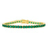 The Midnight Tri-Tone Twilight Tennis Bracelet by Midnight showcases a stunning array of round, vivid green gemstones set continuously in 14K matte gold. The secure clasp adds a decorative touch that complements the bracelet&