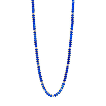 The Midnight Tri-Tone Twilight Oval Station Tennis Necklace by Midnight showcases deep blue beads alternating with 14K matte gold spacers, creating an elegant and evenly spaced design. The uniformly shaped blue beads are beautifully complemented by the small gold spacers, all set against a white background.